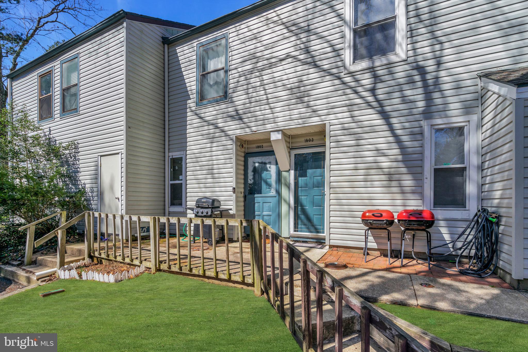a view of a patio with chairs and table in the patio