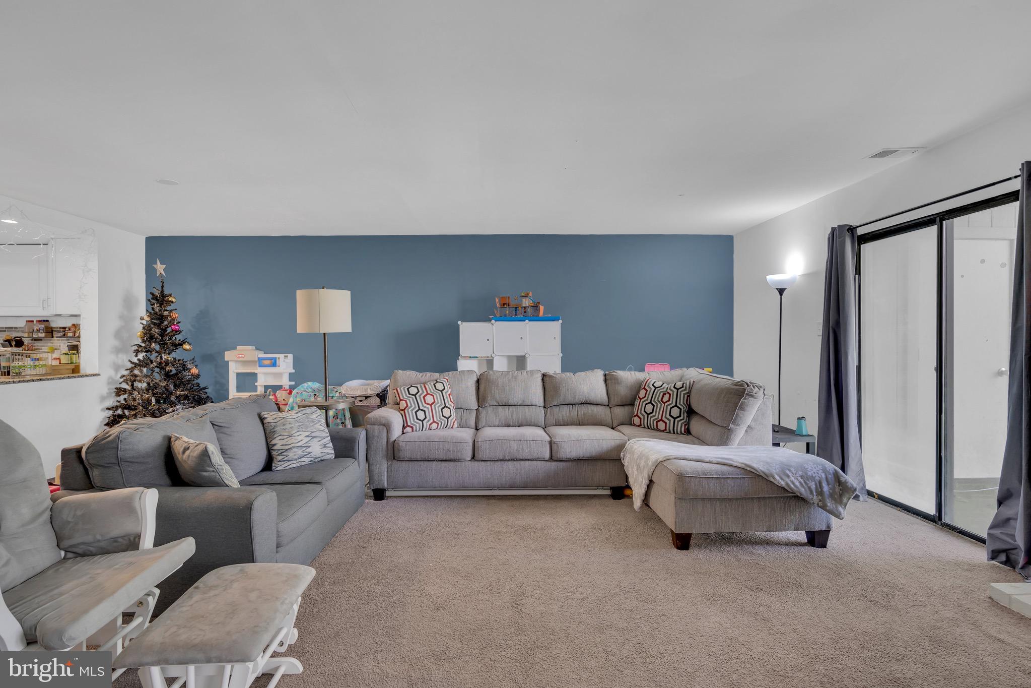 1802 Bromley Estate Pine Hill, NJ 08021 - Photo 12 of 26 a living room with furniture and a potted plant
