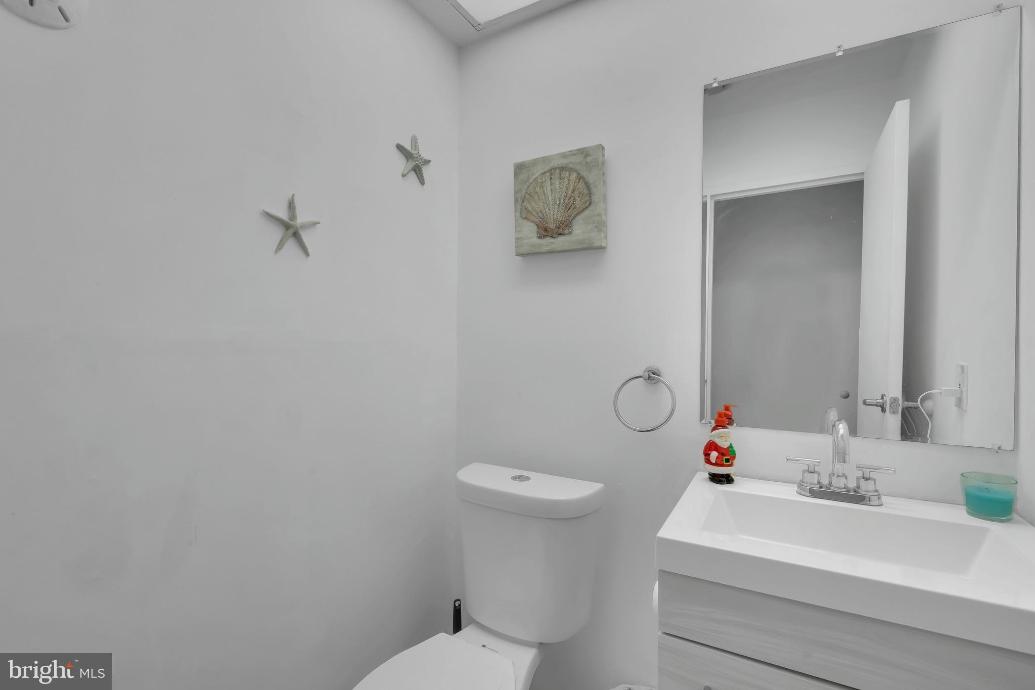 1802 Bromley Estate Pine Hill, NJ 08021 - Photo 14 of 26 a bathroom with a sink mirror vanity and toilet