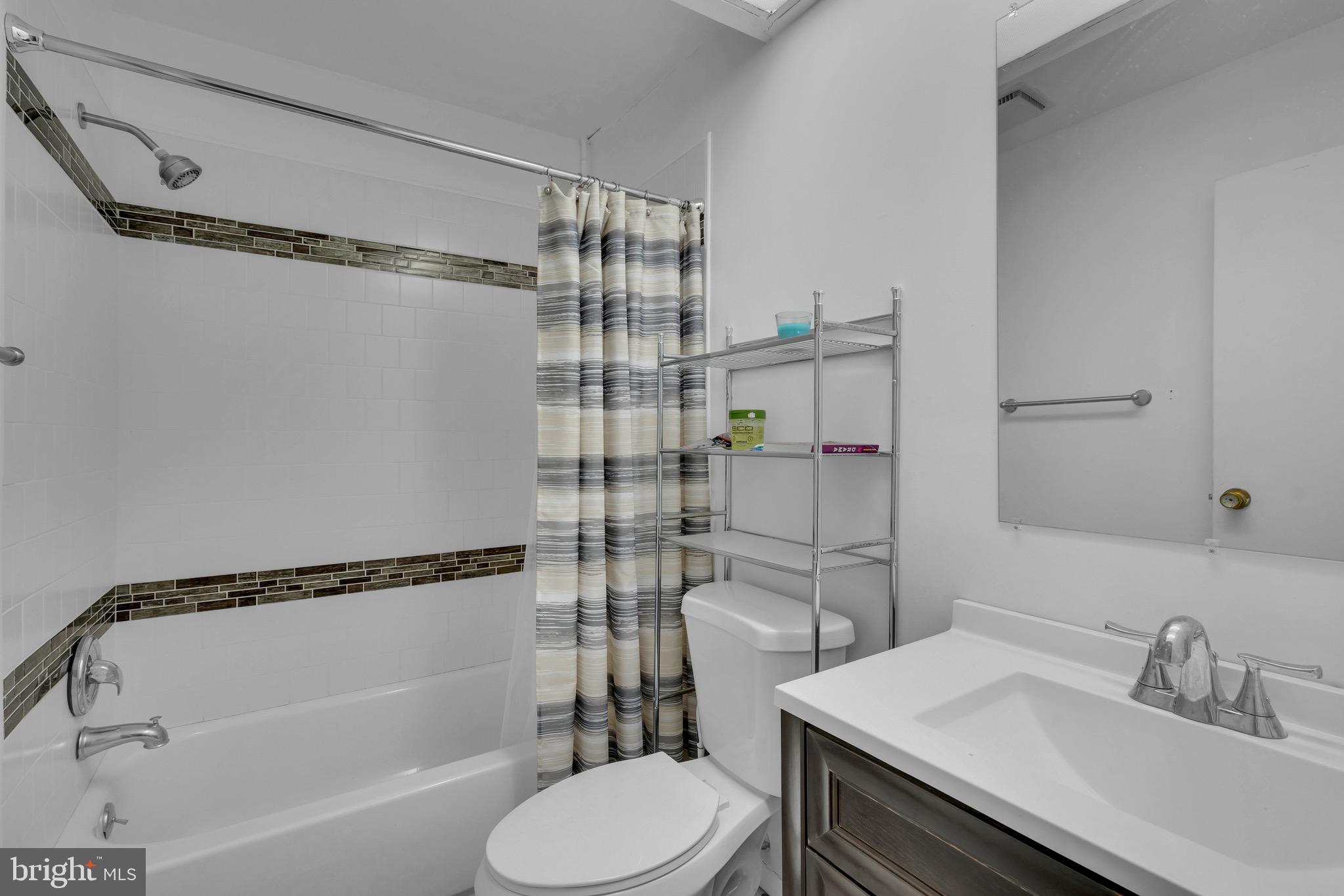 1802 Bromley Estate Pine Hill, NJ 08021 - Photo 17 of 26 a bathroom with a sink toilet and shower