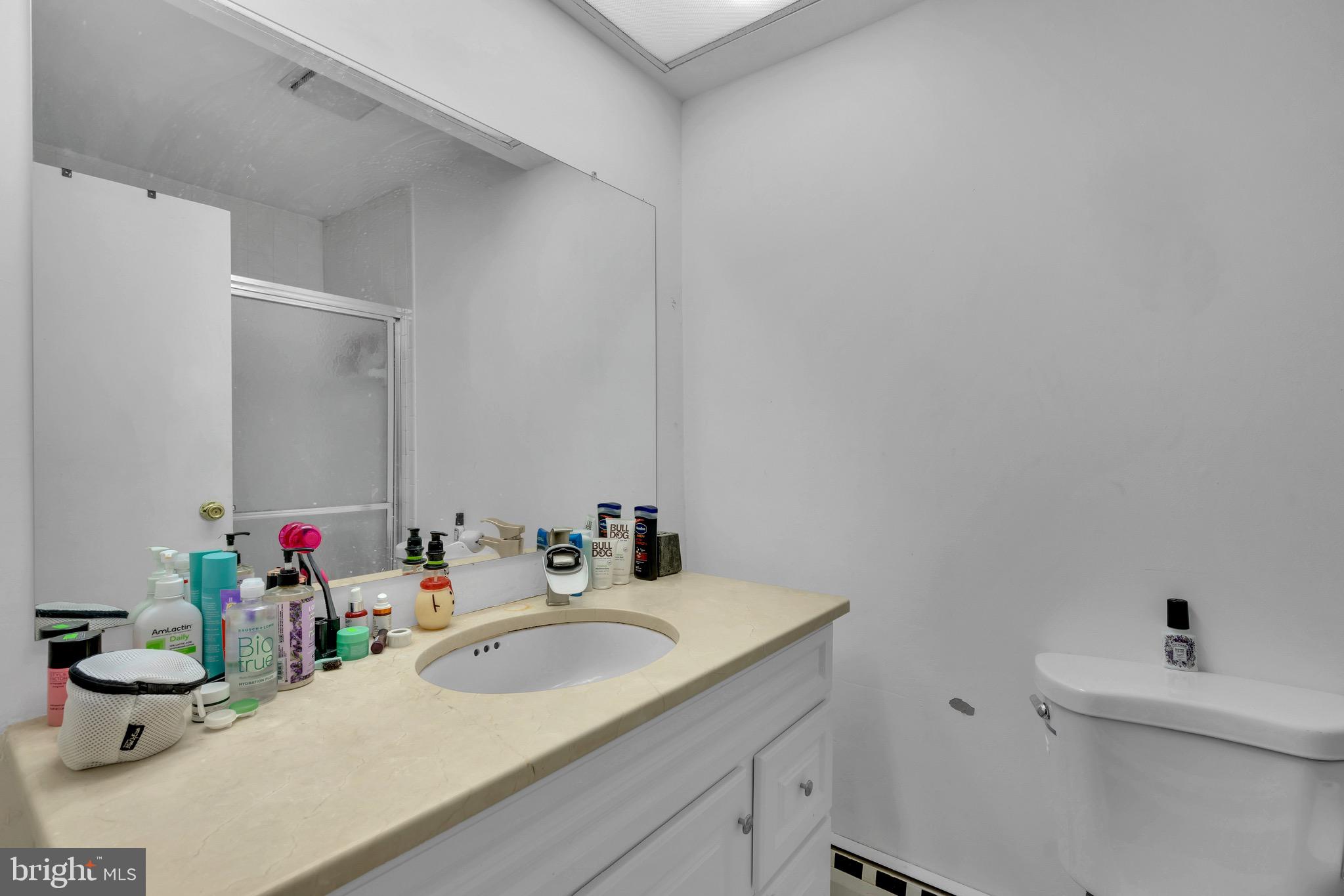1802 Bromley Estate Pine Hill, NJ 08021 - Photo 19 of 26 a bathroom with a sink toilet and a mirror