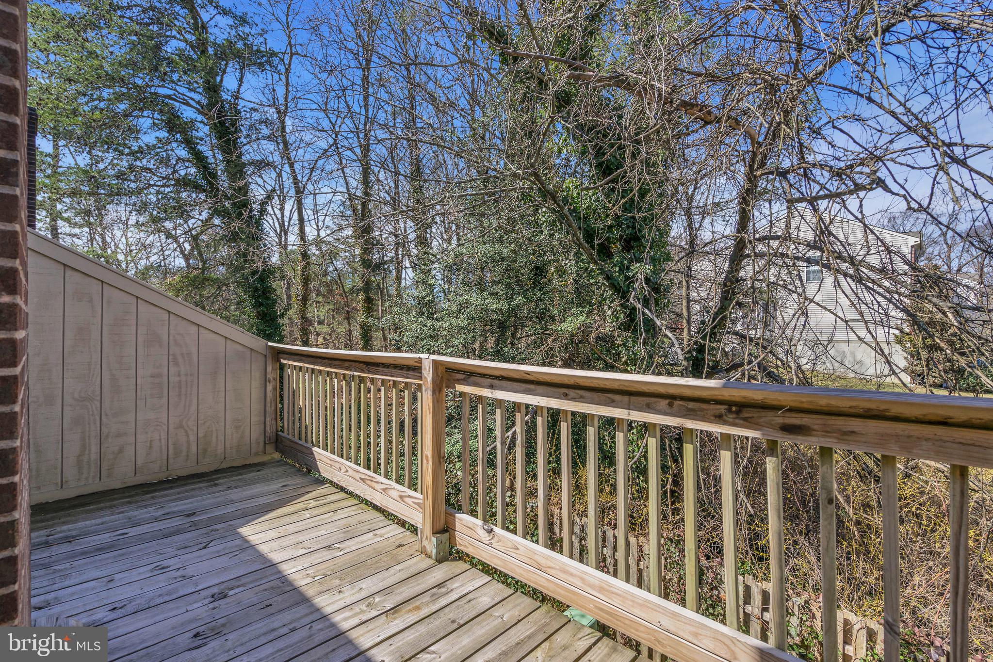 1802 Bromley Estate Pine Hill, NJ 08021 - Photo 21 of 26 a balcony with wooden floor and fence