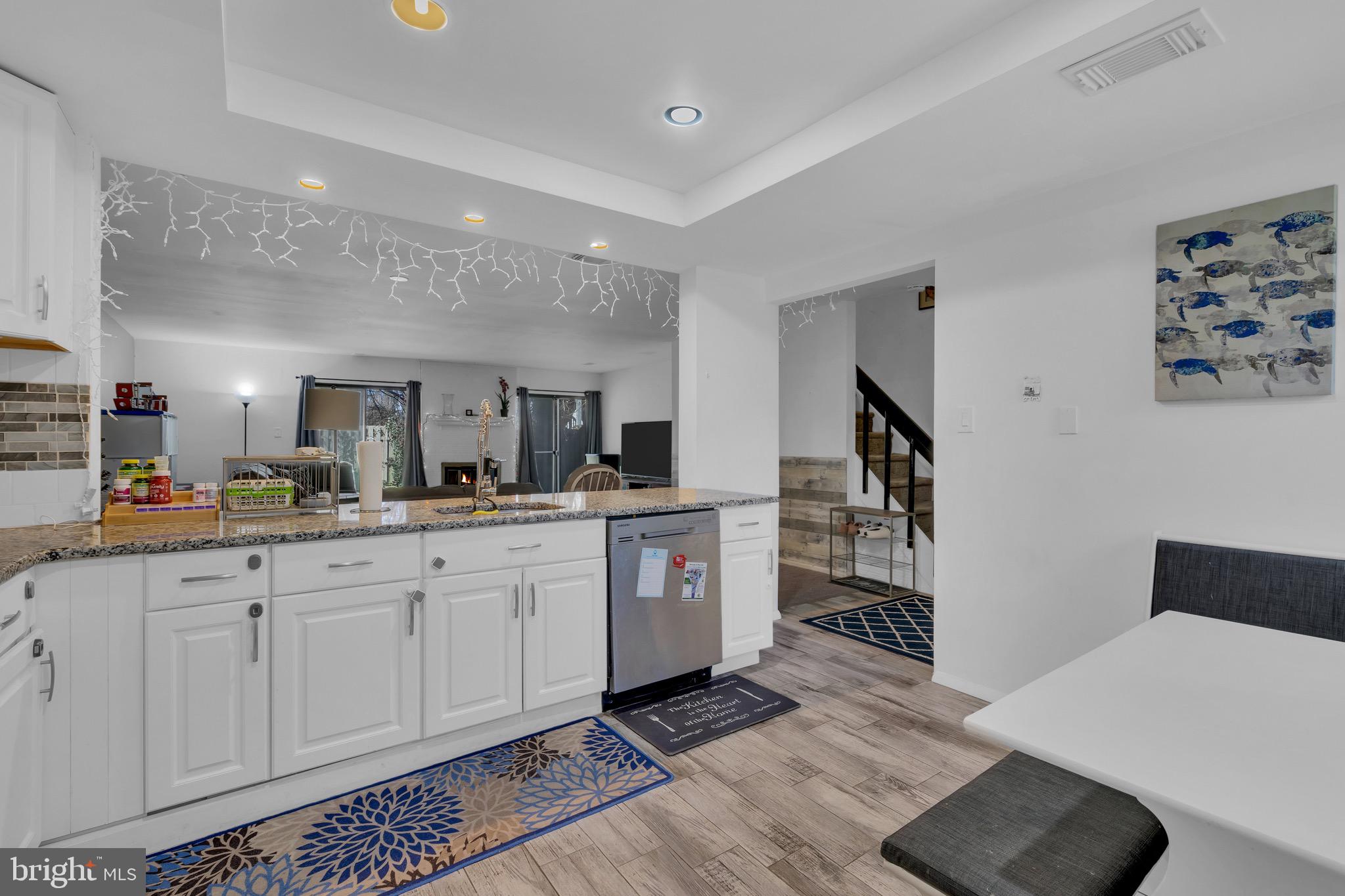 1802 Bromley Estate Pine Hill, NJ 08021 - Photo 10 of 26 a large white kitchen with a sink and dishwasher stove