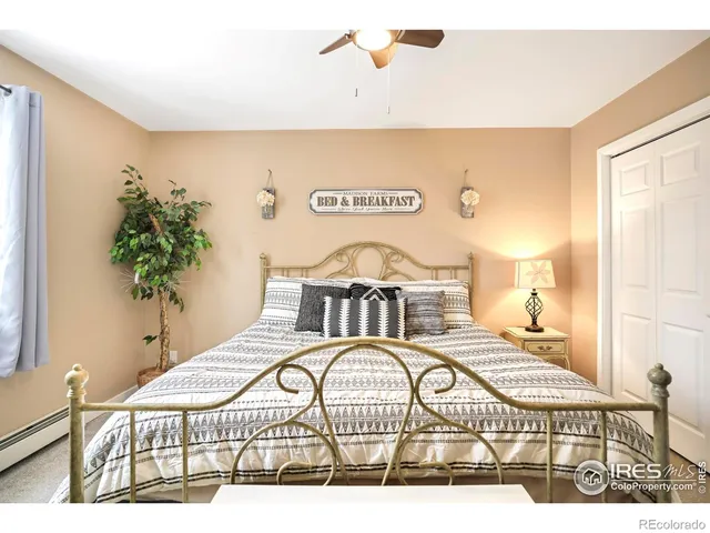 a view of a bedroom with a bed