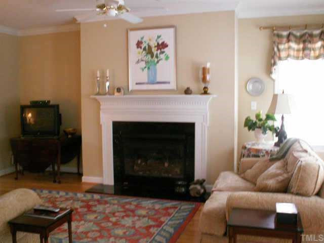 7705 Wilderness Road Raleigh, NC 27613 - Photo 6 of 10 Inviting family room with fireplace and open to kitchen/breakfast Other