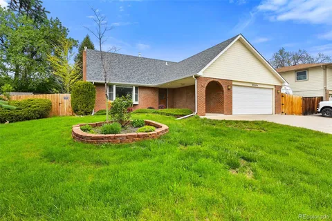 a front view of a house with a yard and porch