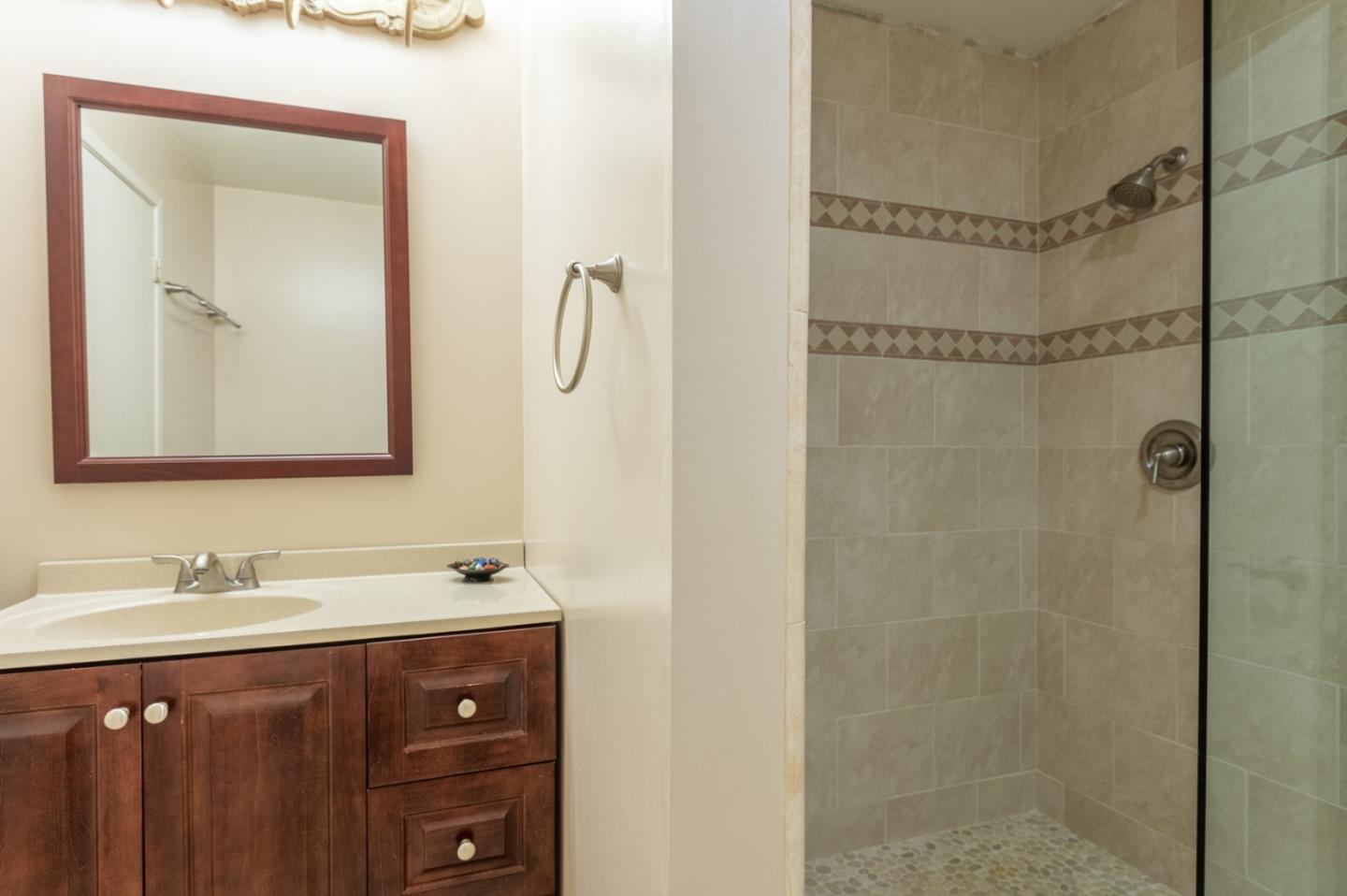 47 Shepherds Knoll Road, Unit 47 Monterey, CA 93940 - Photo 27 of 46 a bathroom with a sink vanity and a mirror