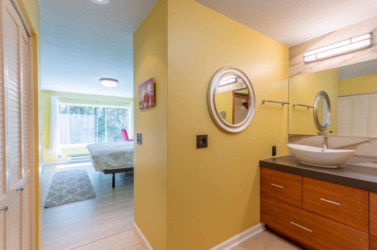 47 Shepherds Knoll Road, Unit 47 Monterey, CA 93940 - Photo 31 of 46 a bathroom with a toilet a sink and a mirror