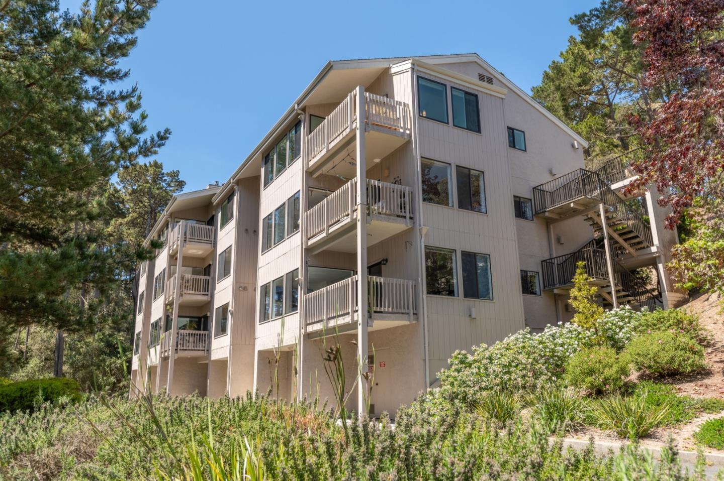 47 Shepherds Knoll Road, Unit 47 Monterey, CA 93940 - Photo 42 of 46 a view of a building with a garden