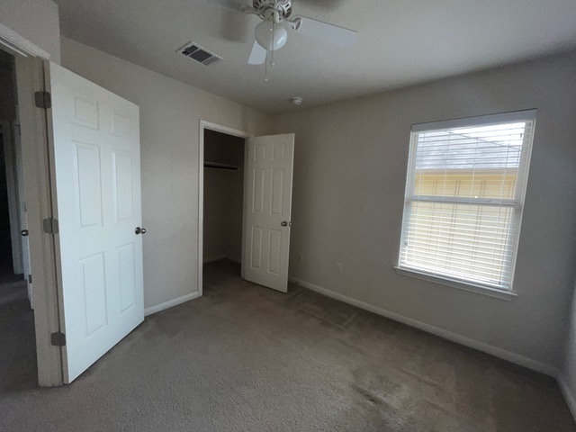 5425 Falling Leaf Lane Austin, TX 78744 - Photo 20 of 28 a view of an empty room with a window