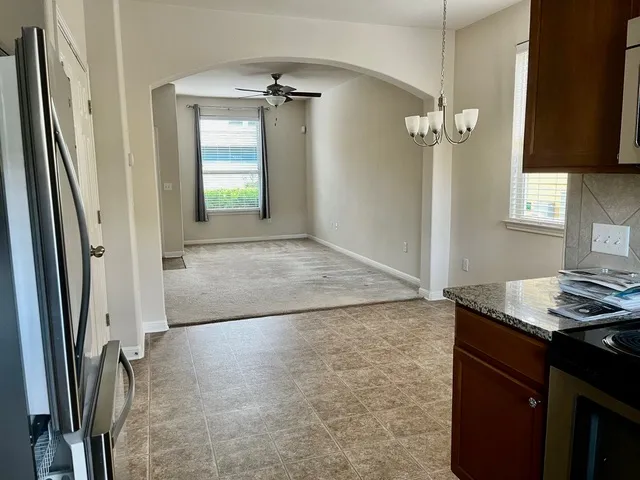a view of a kitchen with a sink and dishwasher
