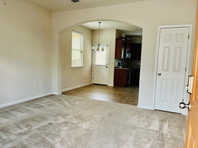 5425 Falling Leaf Lane Austin, TX 78744 - Photo 5 of 28 an empty room with closet and windows