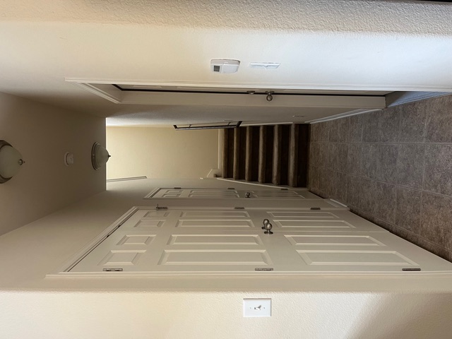 5425 Falling Leaf Lane Austin, TX 78744 - Photo 10 of 28 a view of a hallway with stairs and entryway