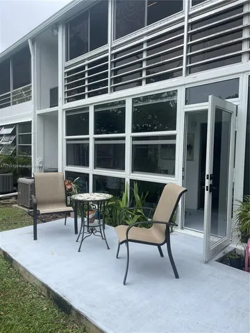a building outdoor space with patio furniture