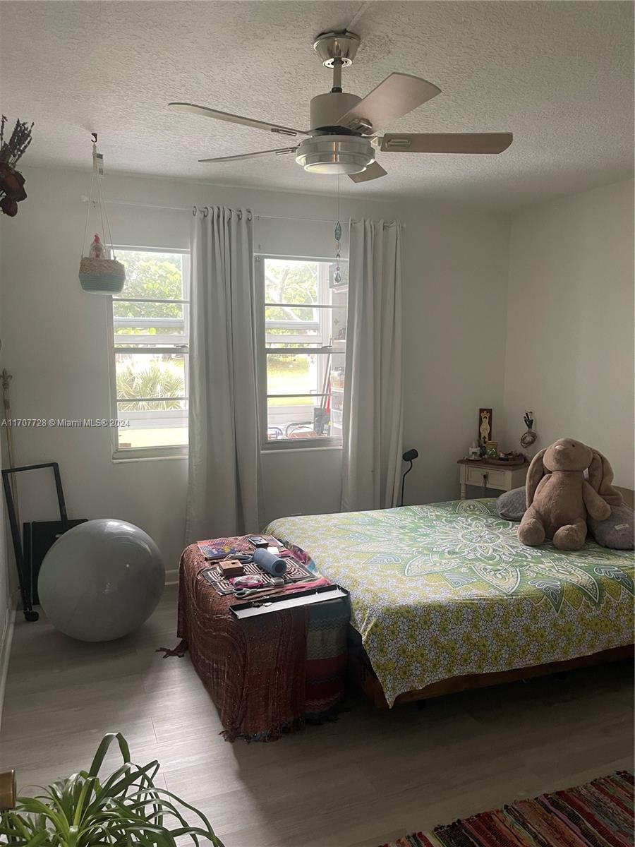191 Prescott J, Unit 191 Deerfield Beach, FL 33442 - Photo 10 of 18 a bedroom with a bed and window