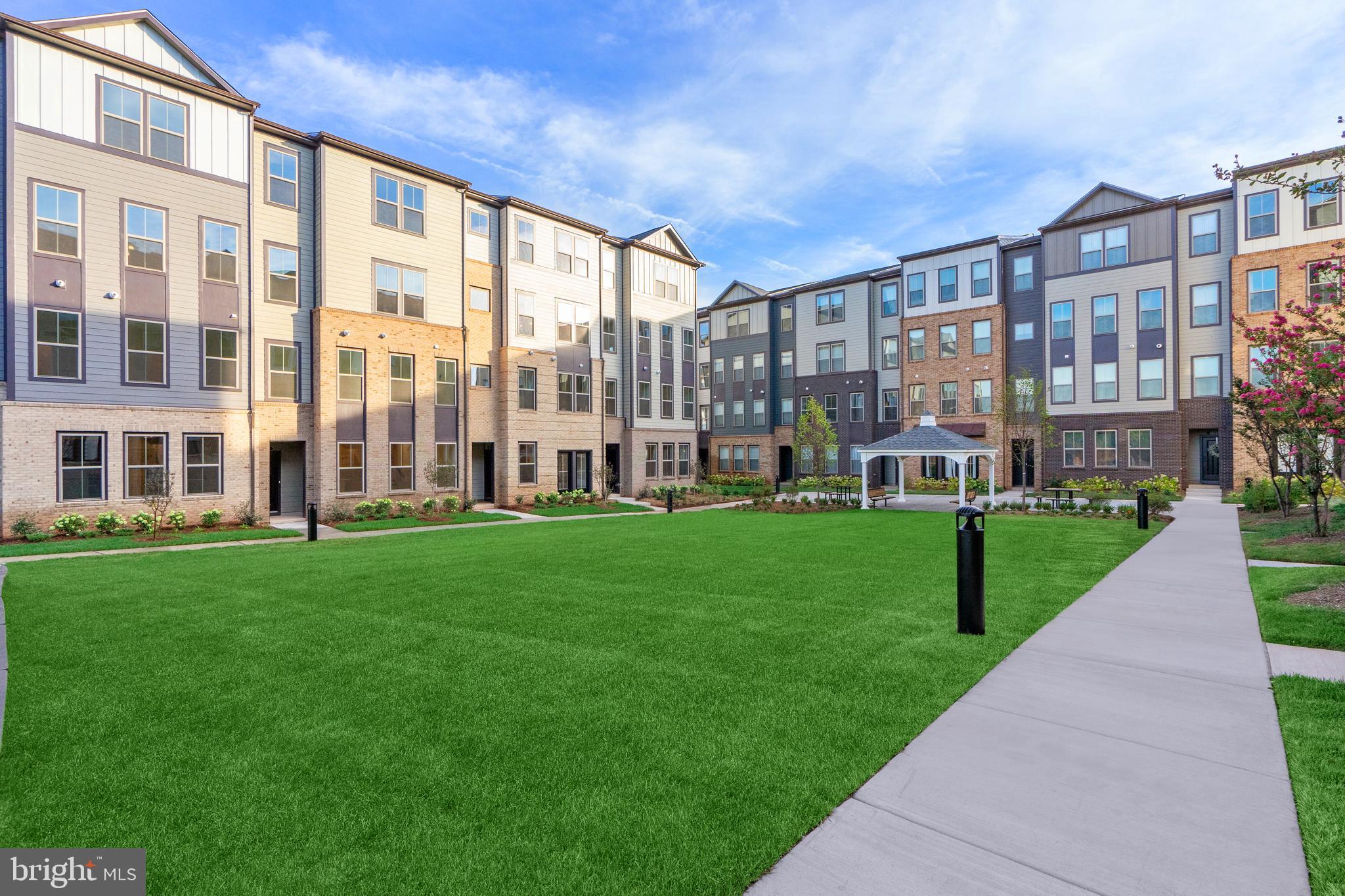 20975 Bluebird Square Sterling, VA 20165 - Photo 16 of 23 a view of a big building with a yard