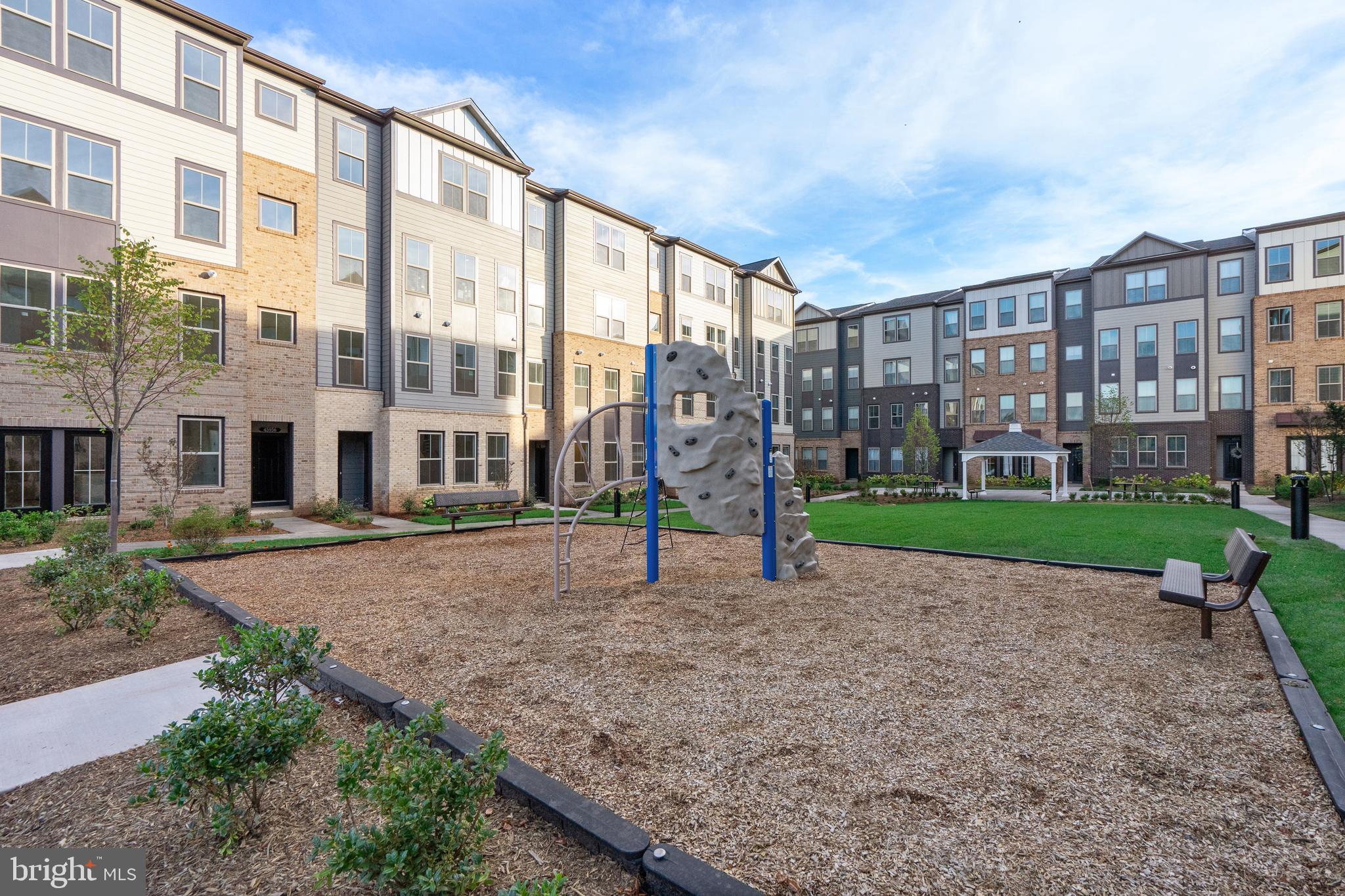 20975 Bluebird Square Sterling, VA 20165 - Photo 17 of 23 a view of a building with a yard