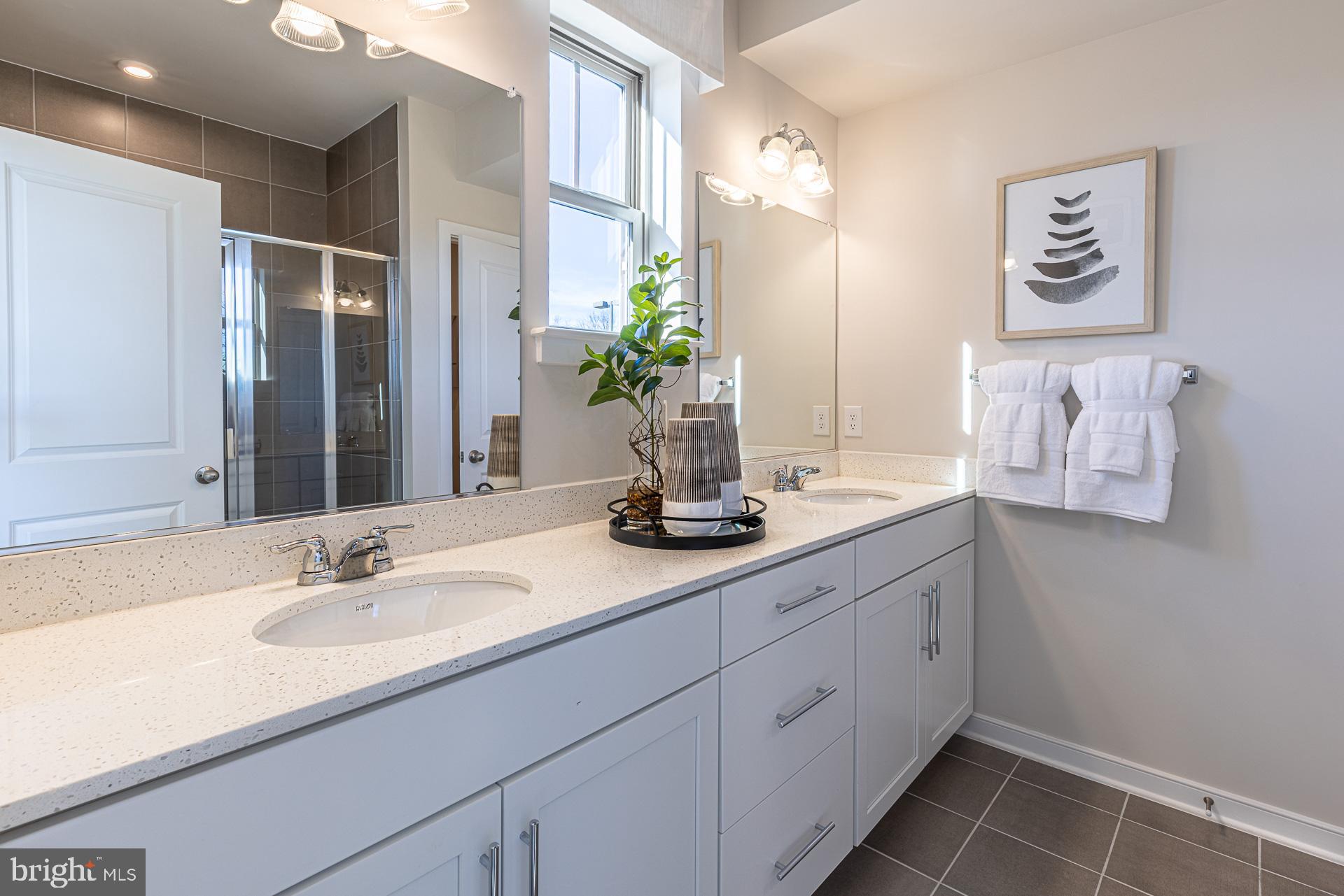 20975 Bluebird Square Sterling, VA 20165 - Photo 5 of 23 a bathroom with a double vanity sink and a mirror