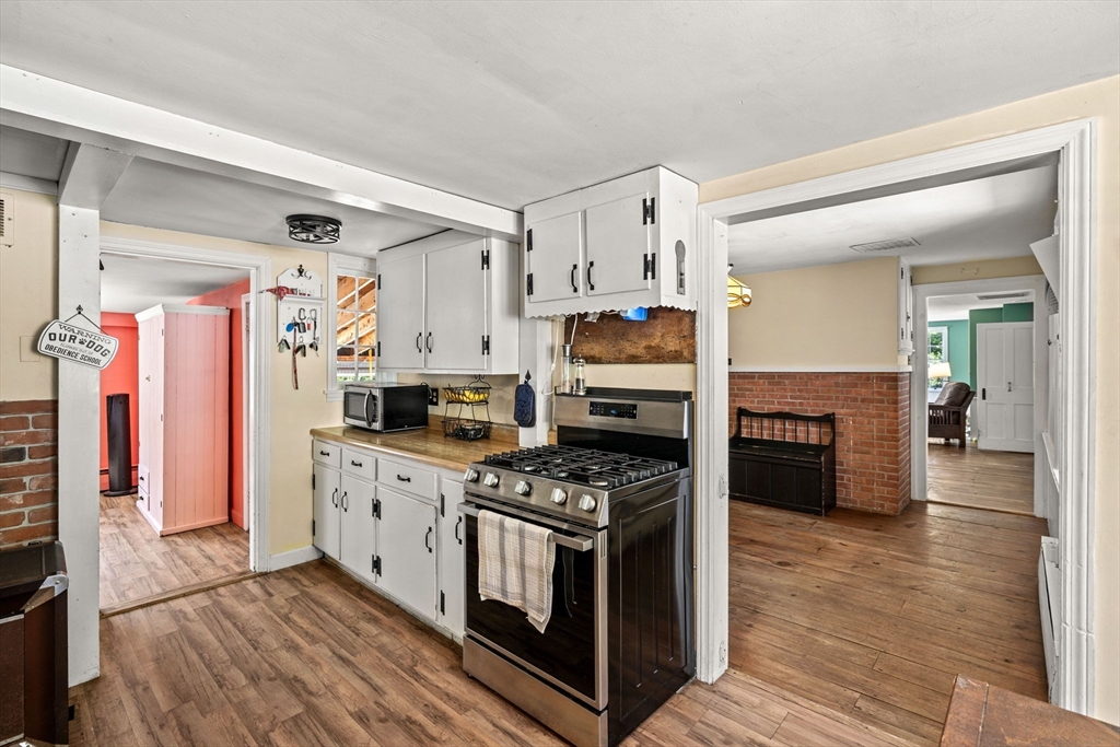 600 Main Street Ashby, MA 01431 - Photo 6 of 40 a kitchen with stainless steel appliances granite countertop a stove and a sink
