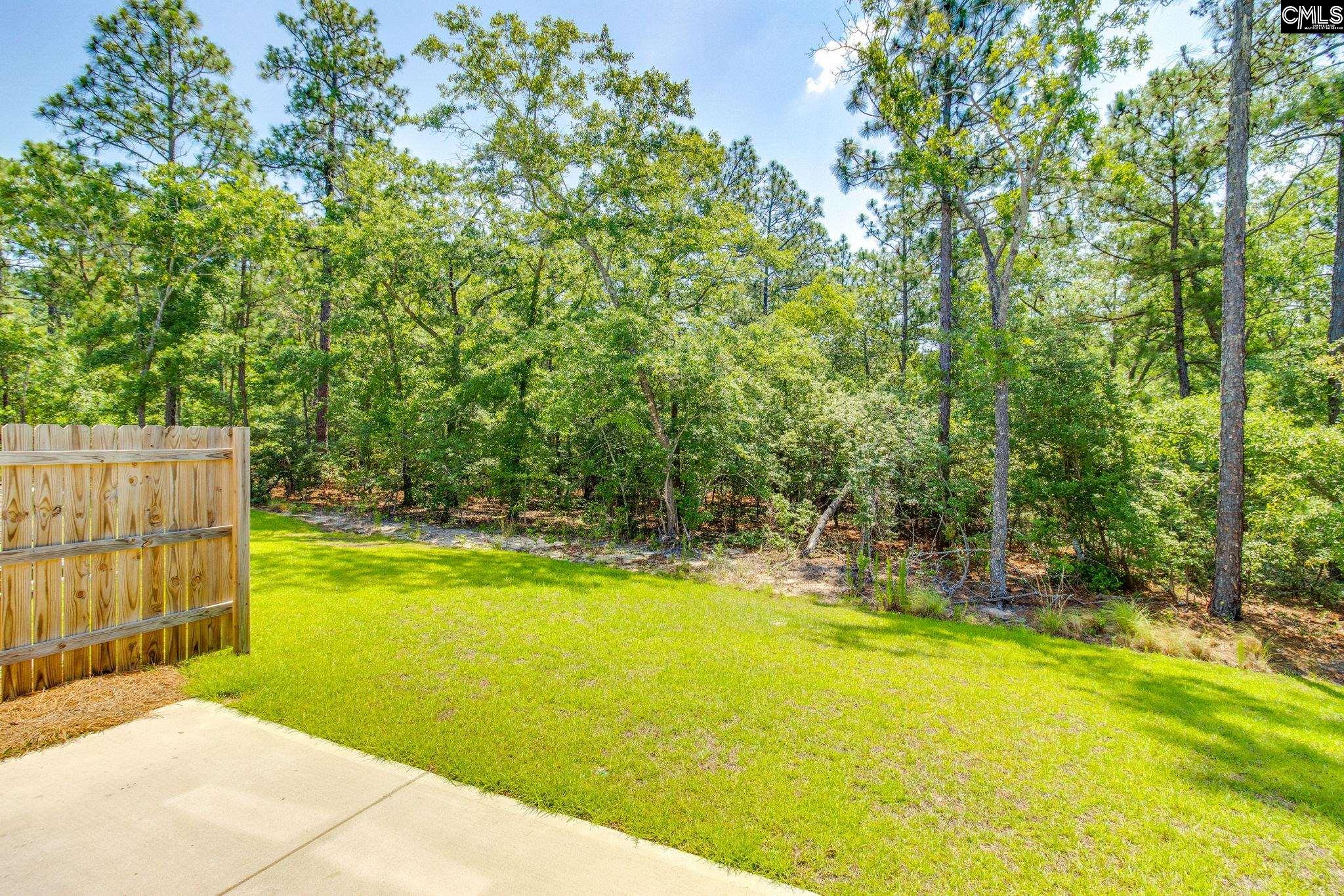 312 Reedmace Court Lexington, SC 29072 - Photo 27 of 29 a view of a swimming pool with an outdoor space and seating area