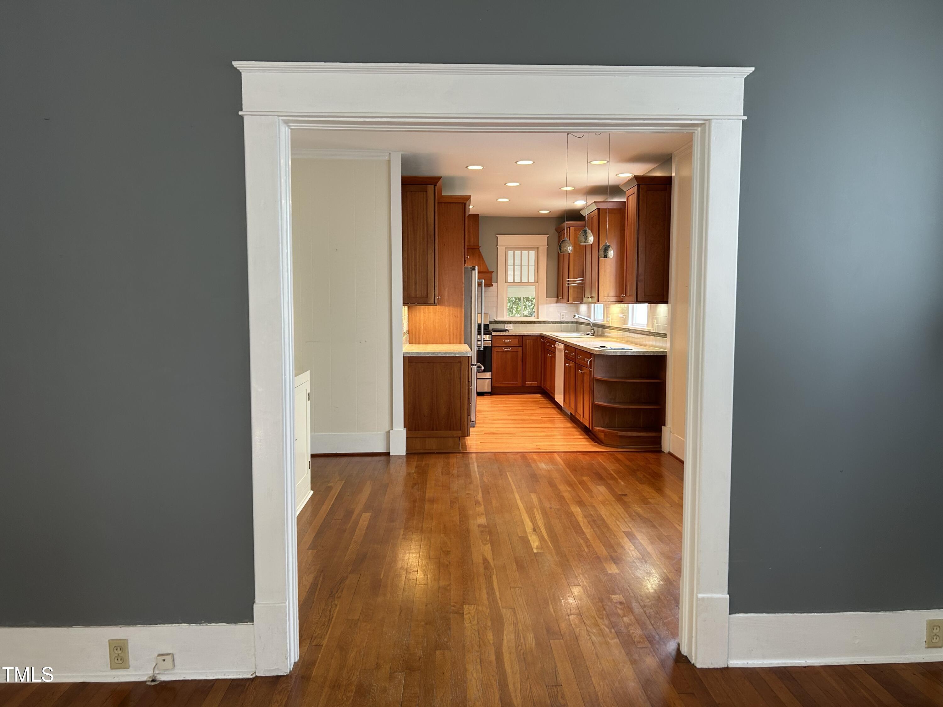 306 Perry Street Raleigh, NC 27608 - Photo 11 of 48 a view of living room with furniture and wooden floor