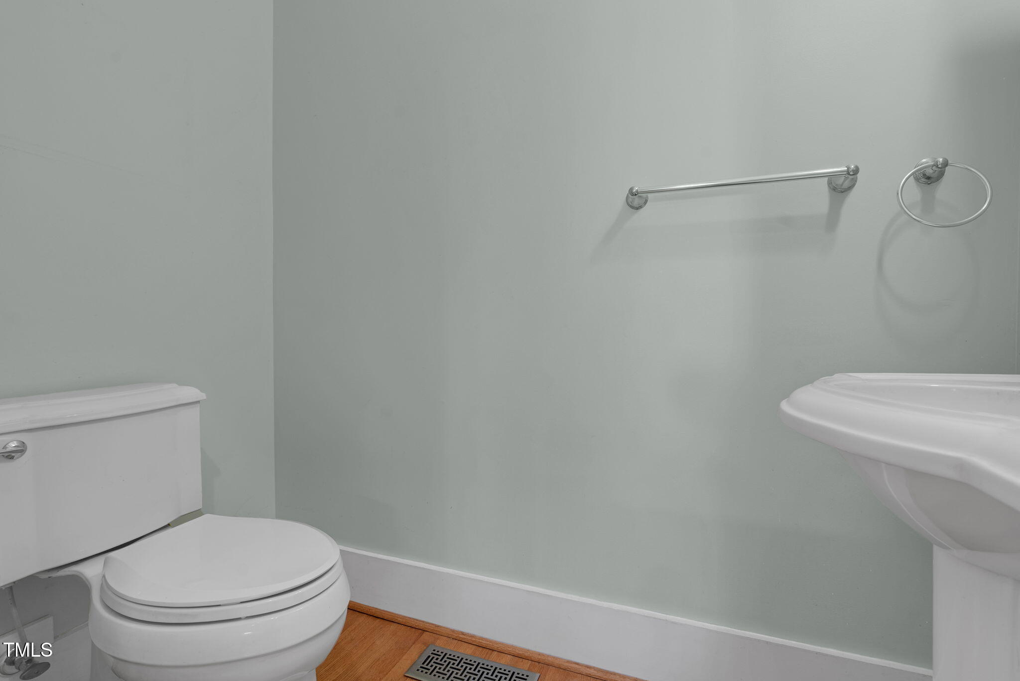 306 Perry Street Raleigh, NC 27608 - Photo 21 of 48 a white toilet sitting next to a bath tub