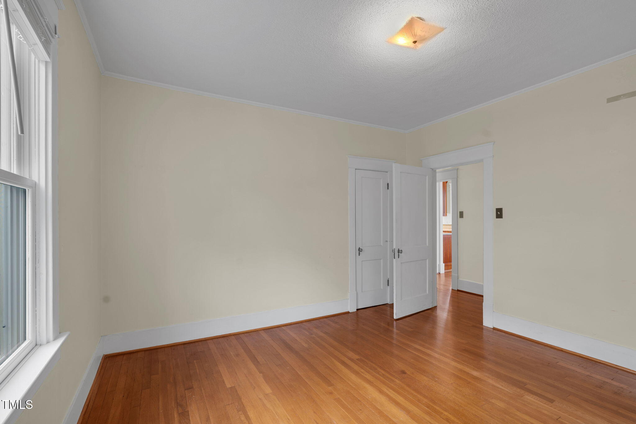 306 Perry Street Raleigh, NC 27608 - Photo 29 of 48 a view of an empty room and wooden floor