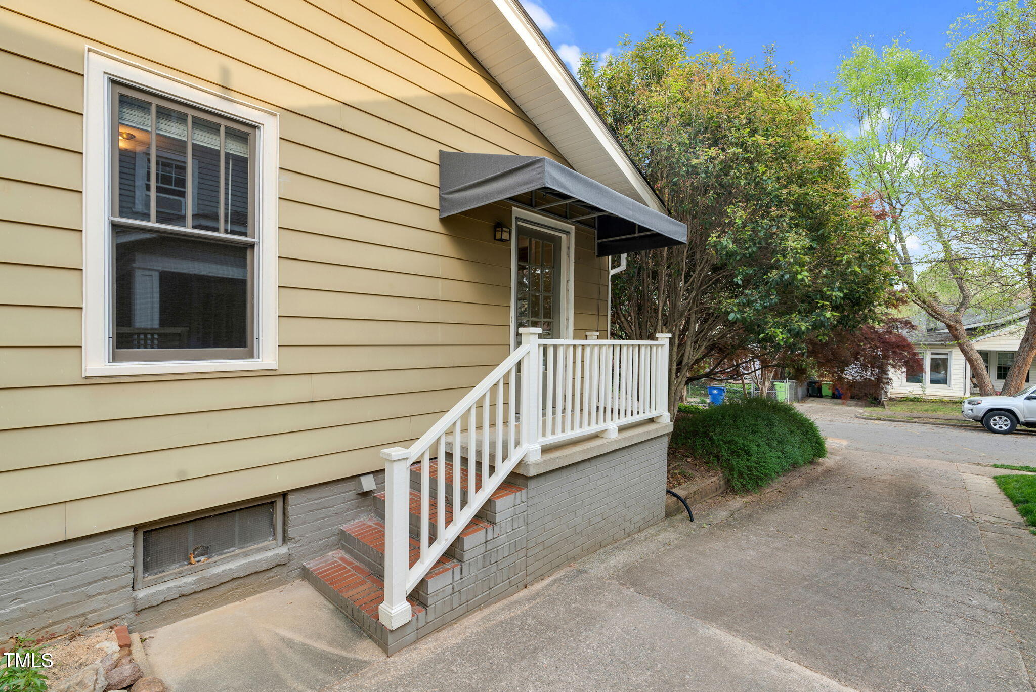306 Perry Street Raleigh, NC 27608 - Photo 33 of 48 a view of a house with a yard and porch