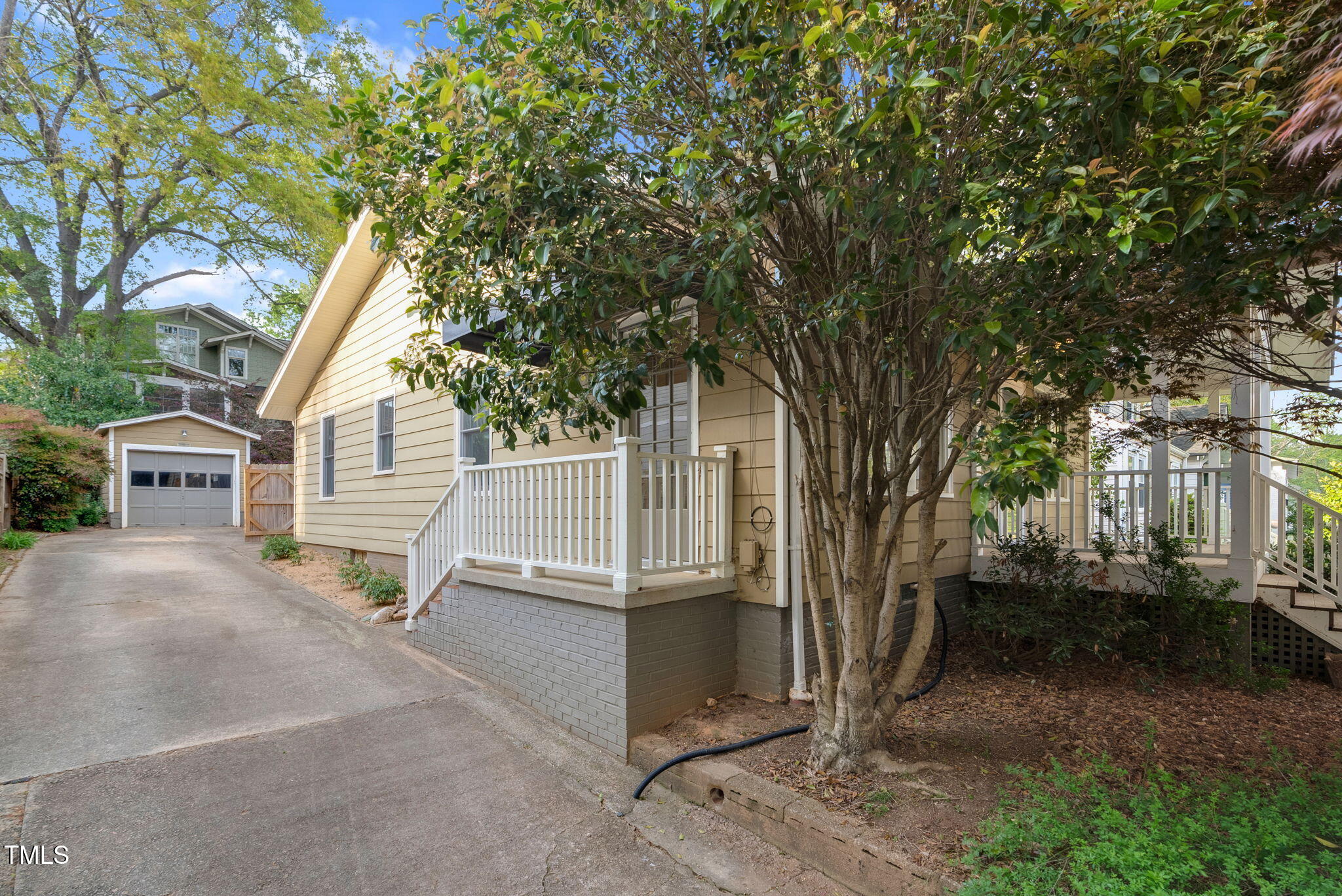 306 Perry Street Raleigh, NC 27608 - Photo 34 of 48 front view of a house with a tree