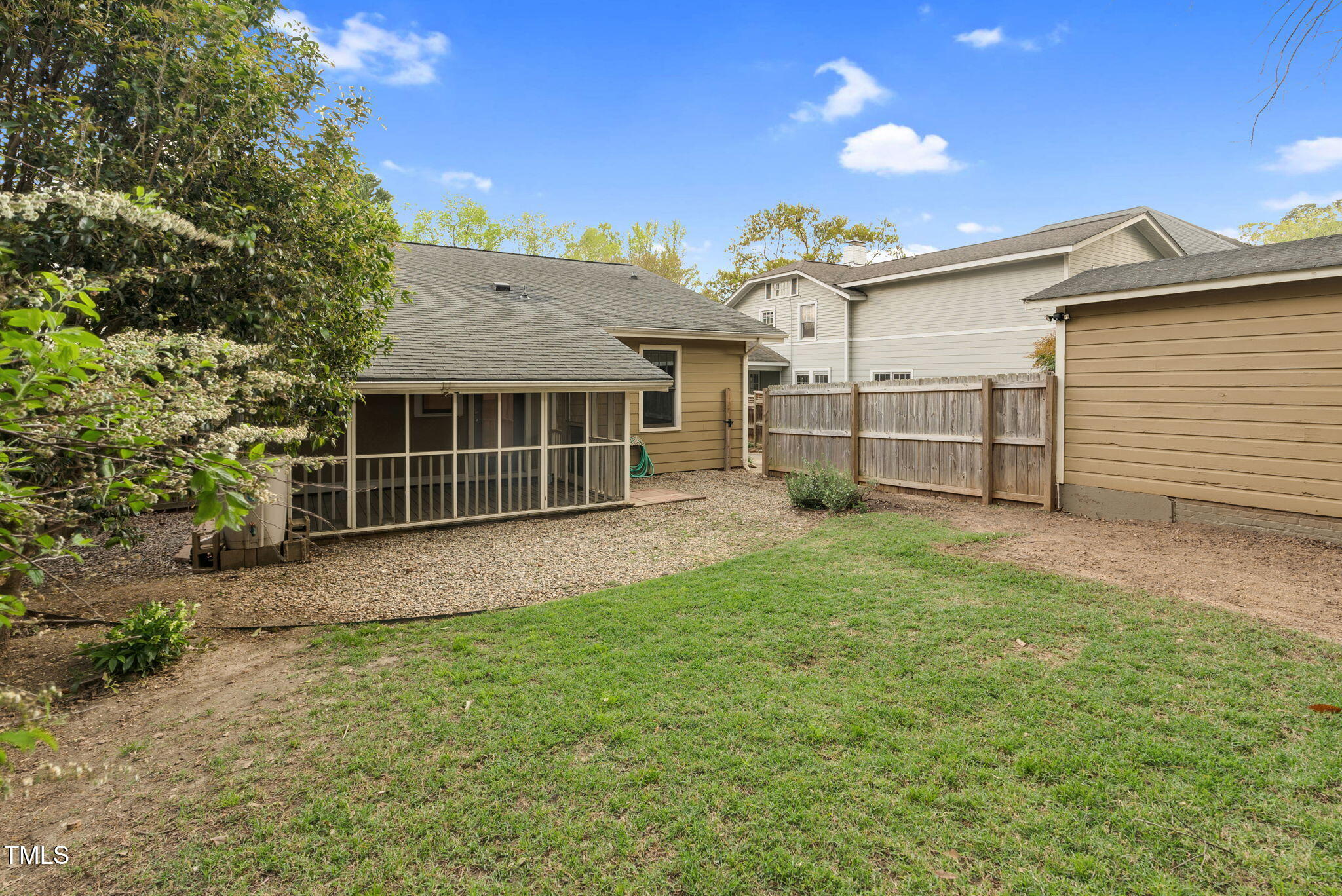 306 Perry Street Raleigh, NC 27608 - Photo 39 of 48 a view of backyard with a garden and deck