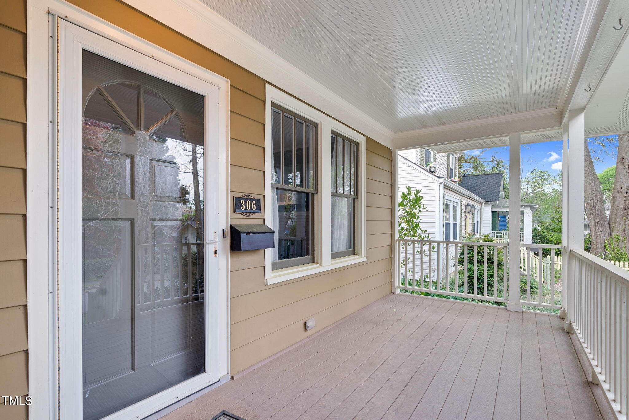 306 Perry Street Raleigh, NC 27608 - Photo 7 of 48 a view of front door and porch with wooden floor