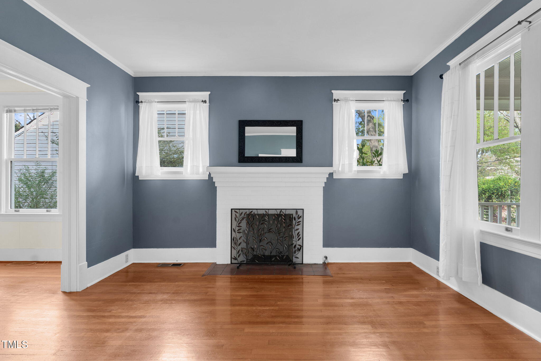 306 Perry Street Raleigh, NC 27608 - Photo 9 of 48 a living room with furniture and a fireplace
