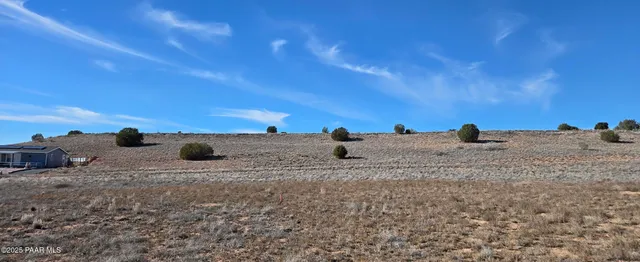 a view of ocean beach and mountain
