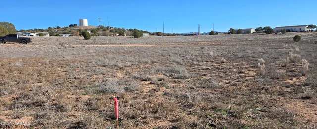 a view of a road with a building in the background
