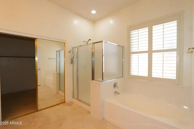 a bathroom with a bathtub and a shower