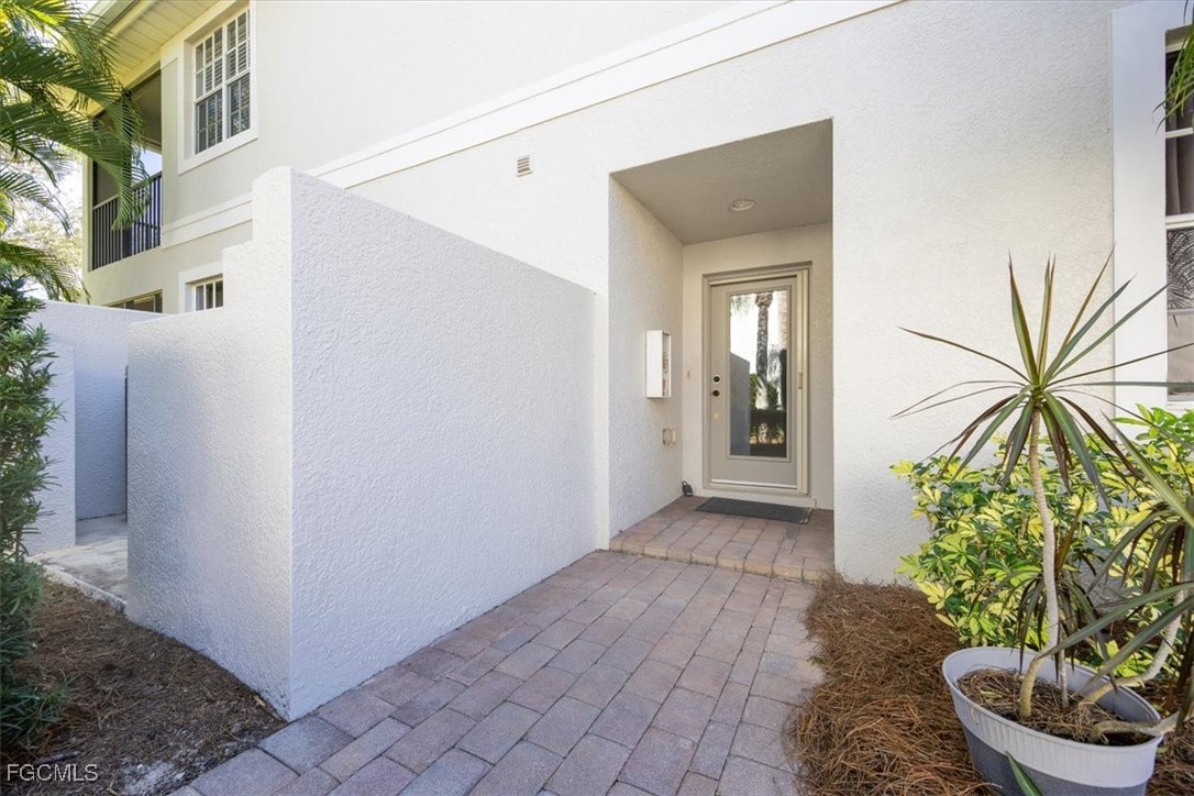 13091 Pebblebrook Ridge Court, Unit 101 Fort Myers, FL 33905 - Photo 3 of 39 a view of a entryway of a house