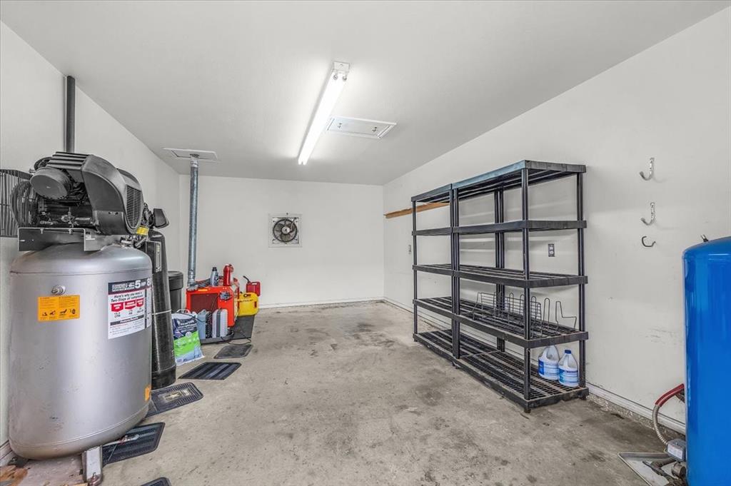 353 Hidden Meadow Court Rhome, TX 76078 - Photo 19 of 28 View of garage