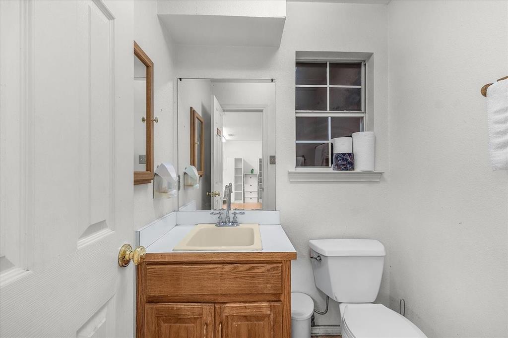 353 Hidden Meadow Court Rhome, TX 76078 - Photo 21 of 28 Bathroom featuring toilet and vanity