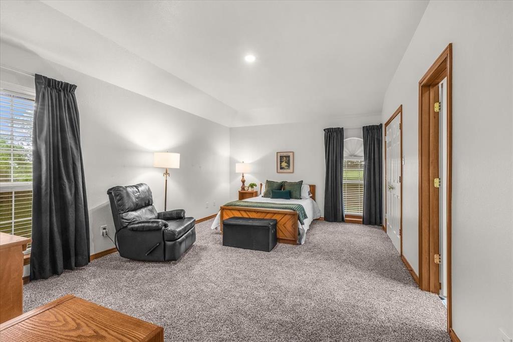 353 Hidden Meadow Court Rhome, TX 76078 - Photo 10 of 28 Carpeted bedroom featuring baseboards
