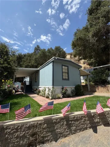 a view of backyard with outdoor seating and green space