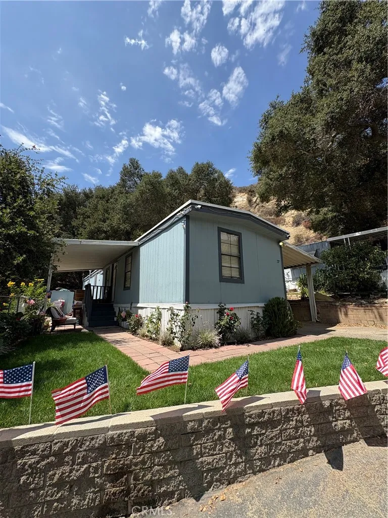 23500 The Old Road, Unit 37 Newhall, CA 91321 - Photo 2 of 22 a view of backyard with outdoor seating and green space