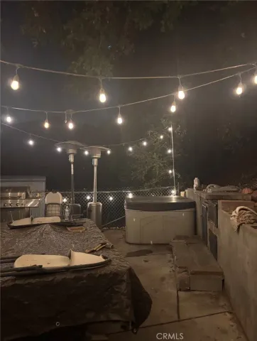 a view of a patio with table and chairs