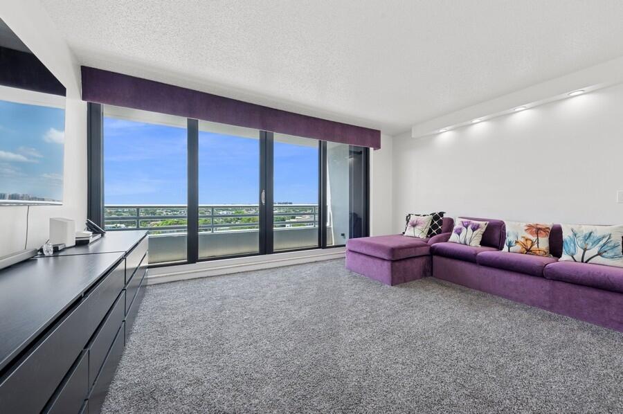 1400 South Ocean Boulevard, Unit 1004 Boca Raton, FL 33432 - Photo 15 of 55 a living room with furniture and a large window