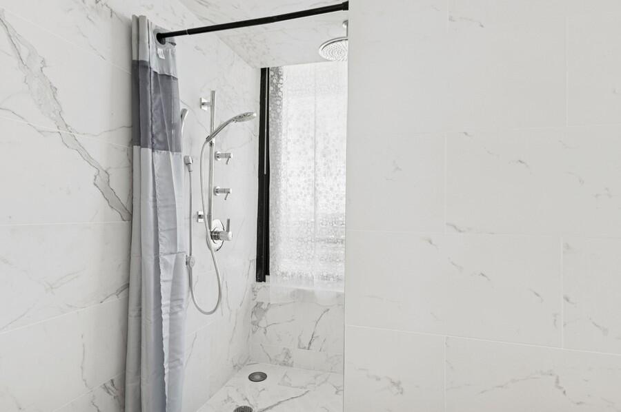 1400 South Ocean Boulevard, Unit 1004 Boca Raton, FL 33432 - Photo 17 of 55 a bathroom with a shower