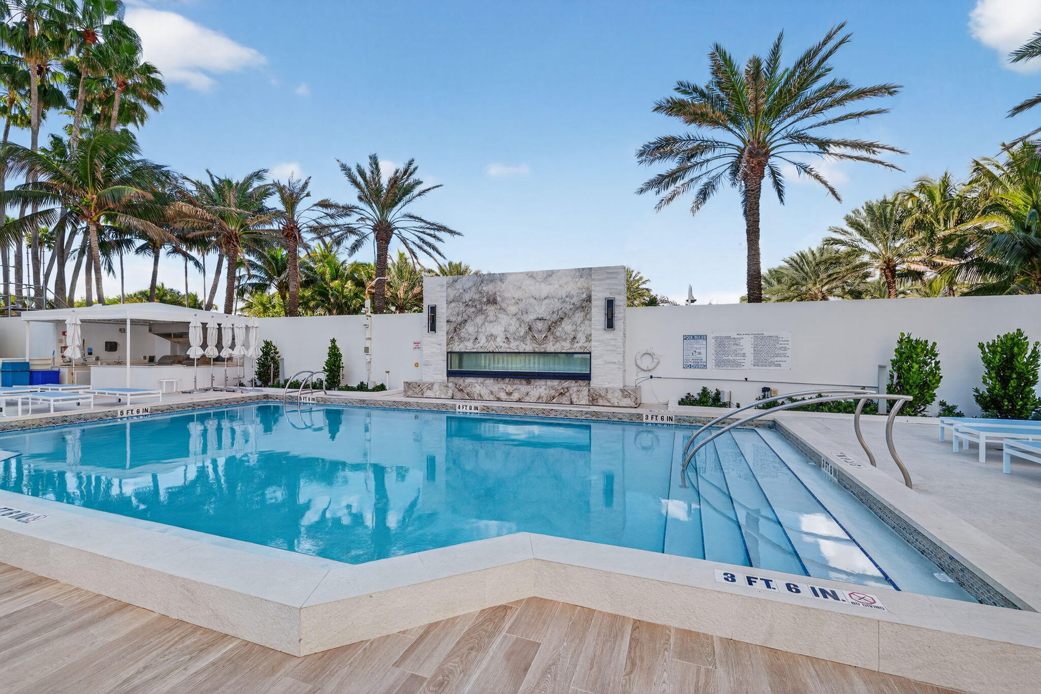 1400 South Ocean Boulevard, Unit 1004 Boca Raton, FL 33432 - Photo 35 of 55 a view of a swimming pool and a chair
