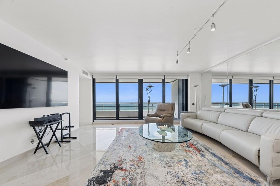 1400 South Ocean Boulevard, Unit 1004 Boca Raton, FL 33432 - Photo 4 of 55 a living room with furniture and view of kitchen