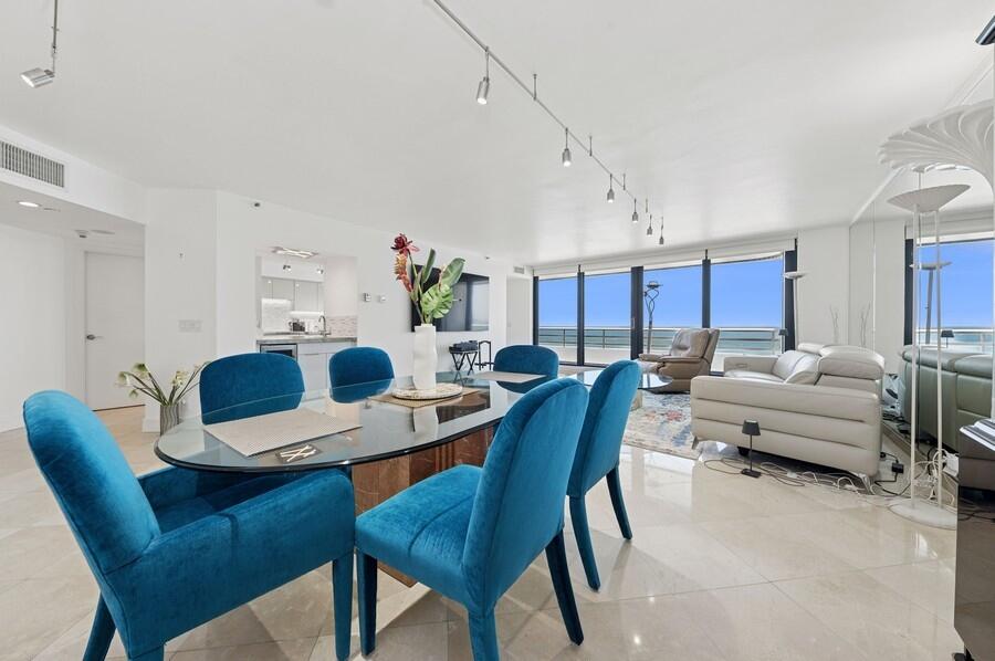 1400 South Ocean Boulevard, Unit 1004 Boca Raton, FL 33432 - Photo 6 of 55 a view of a dining room with furniture and a chandelier