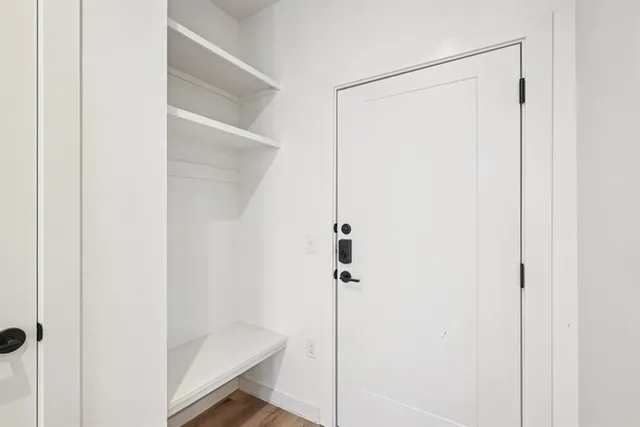 a large kitchen with a sink and refrigerator
