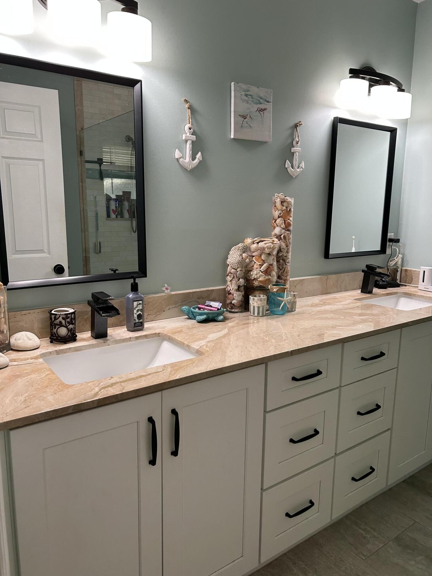1371 Southwest 4th Street Boca Raton, FL 33486 - Photo 8 of 19 a bathroom with a granite countertop sink vanity and mirror