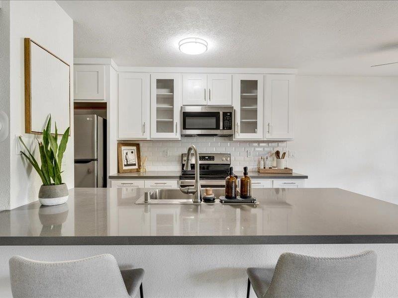 4475 Diamond Street, Unit 3 Capitola, CA 95010 - Photo 3 of 25 a view of kitchen with microwave a stove and cabinets